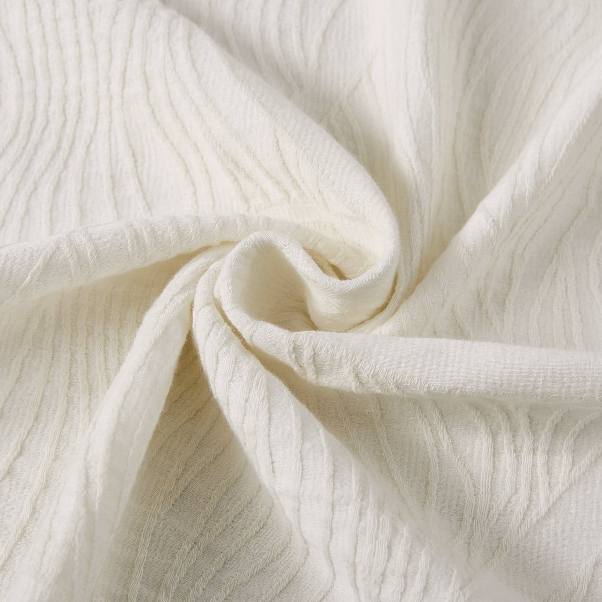 Close-up of textured white fabric of shower curtain