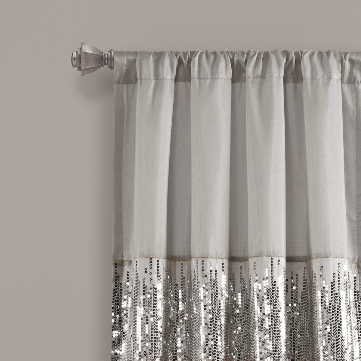 Silver sequin curtain with a plain background