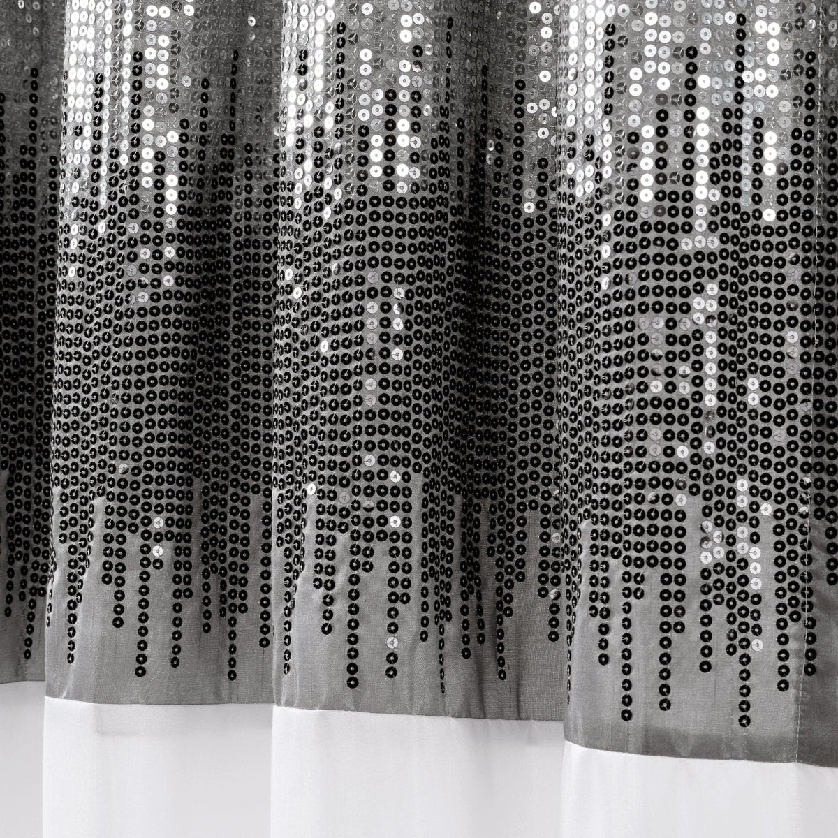 Close-up of a sequin curtain with a black and white color scheme.