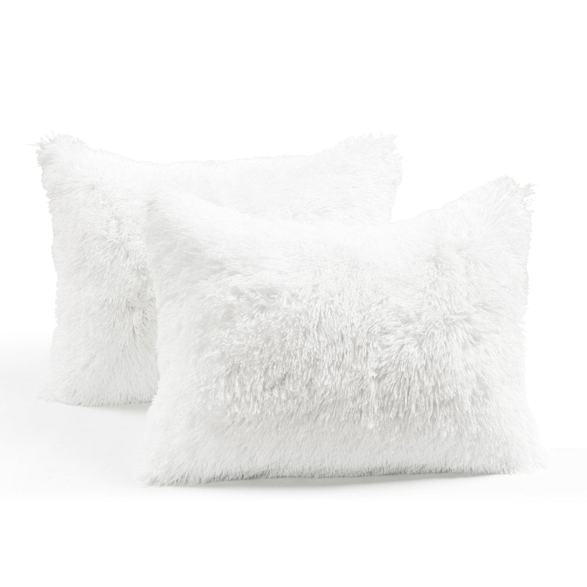 Two white fluffy pillows on a white background