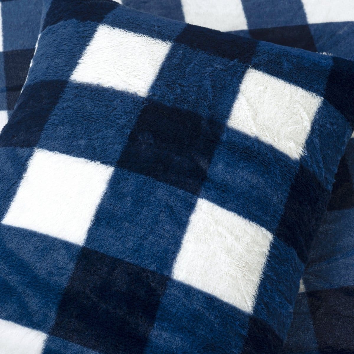 Close-up of blue and white checkered fabric. Faux fur checkered comforter bed set