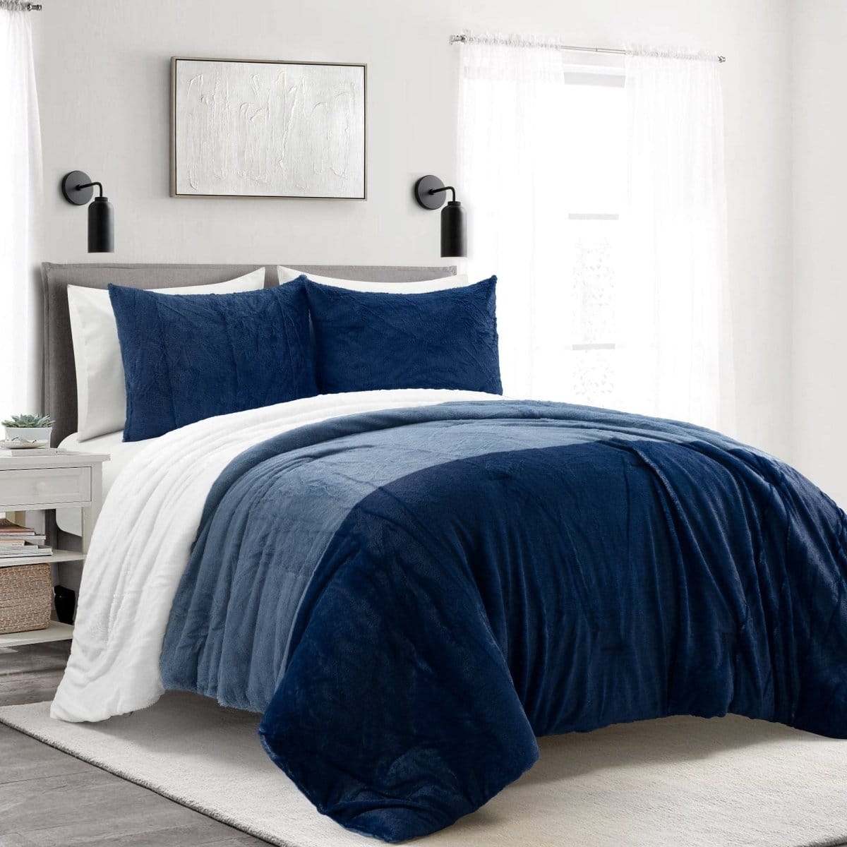 Bed with blue and white bedding in a bedroom setting. Farmhouse Faux Fur Comforter Set - Ultra Soft Color Block Bedding | LushDecor