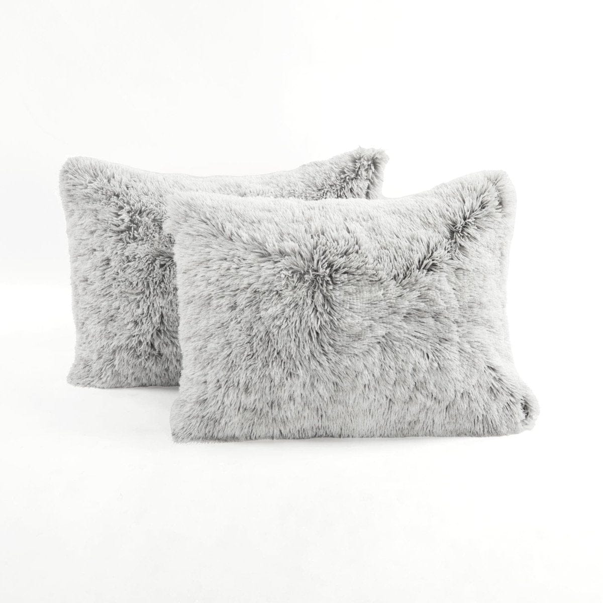 Two gray fluffy pillows. Ultra-soft two-tone faux fur comforter set by LushDecor. Complete bedding set with comforter & shams. Machine washable luxury. 8.5 lbs, all-season comfort.