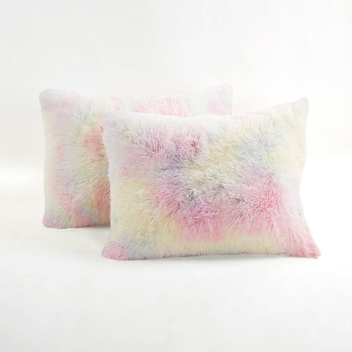 Two pastel tie-dye pillows on a white background