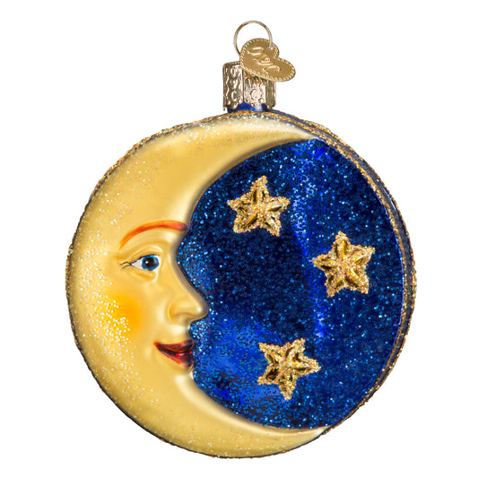 Decorative ornament shaped like a half-moon with a face and stars on a white background. Two sided. 