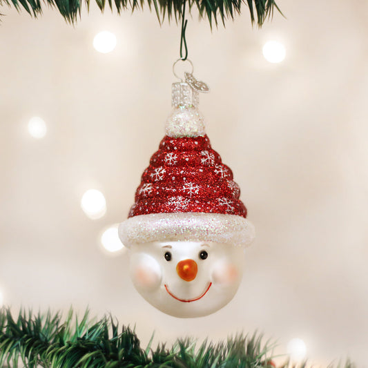Add a cheerful red-and-white accent to your Christmas tree with the Candy Coil Snowman ornament from Old World Christmas. Its smiling snowman face sits beneath a tall, coiled red hat decorated with white snowflakes and glitter detailing.