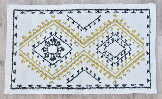 Decorative silk,  wool and viscose blend rug with geometric pattern on a wooden floor
