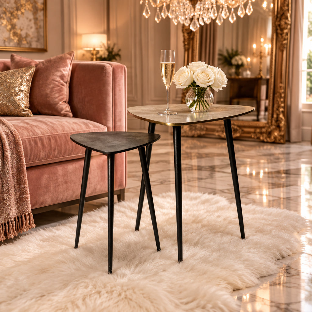 Two small tables with a light wood top and black legs on a white background