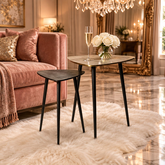 Two small tables with a light wood top and black legs on a white background