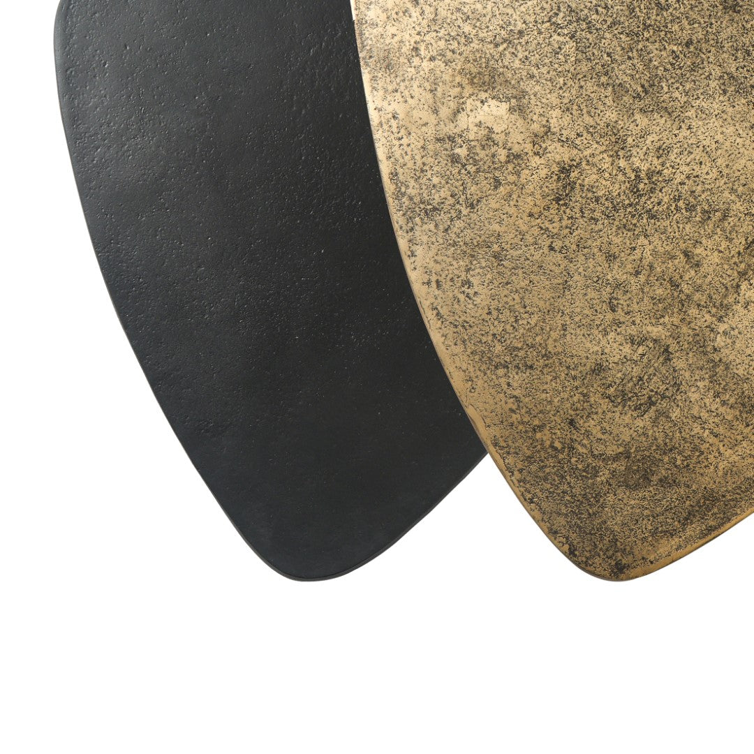 Close-up of a black and a textured beige stone on a white background
