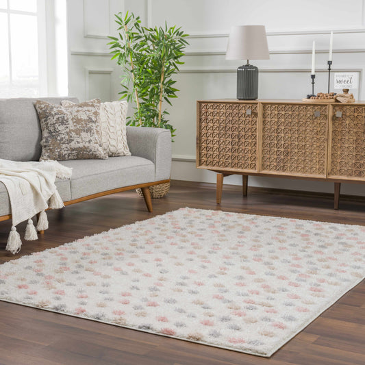 Polka dot patterned runner rug with shades of cream, pink, white, beige. Powdery cream color blend.