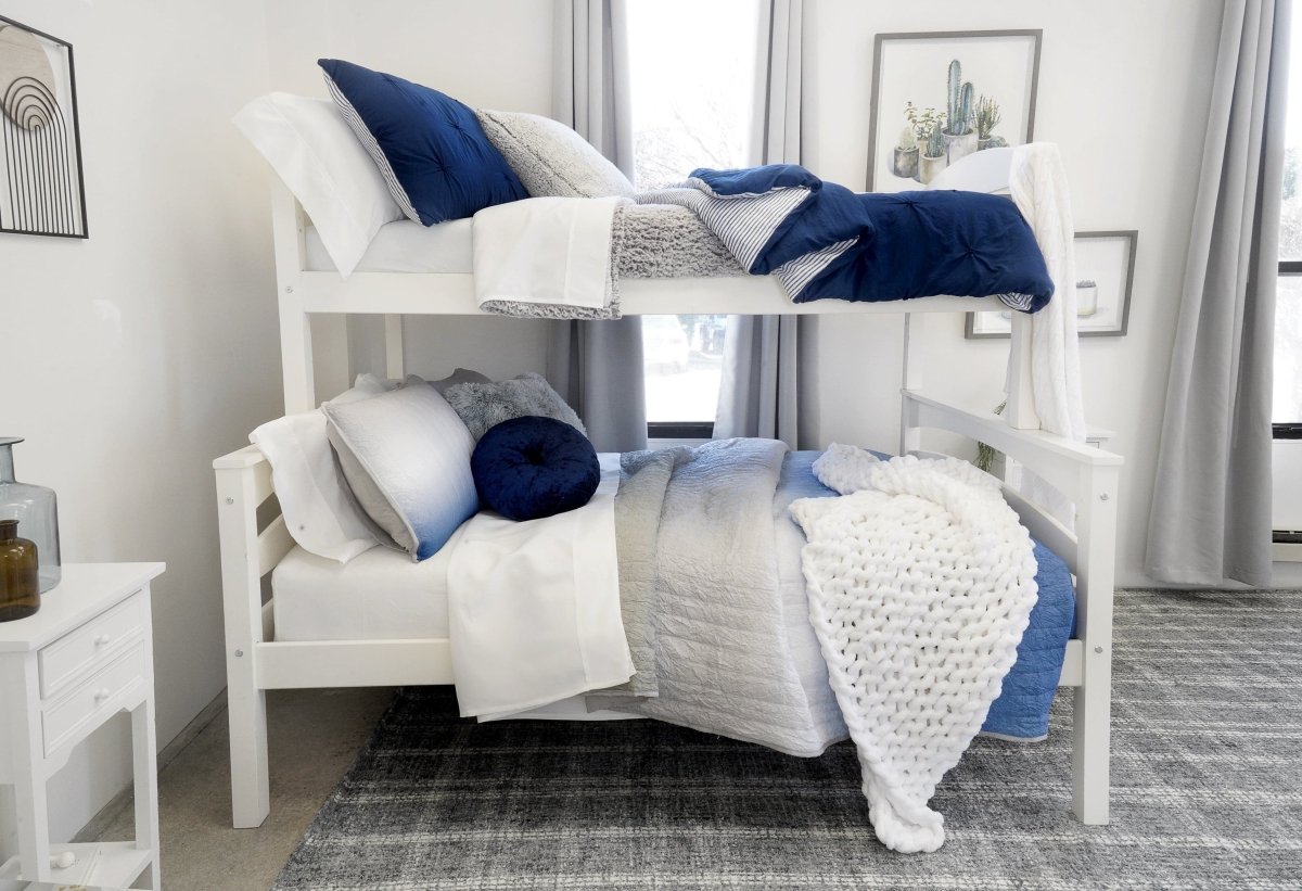 Bunk bed with white and blue bedding in a room with a nightstand and window. Faux fur bedding bed set.
