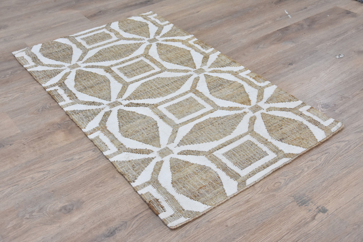 Patterned rug on a wooden floor