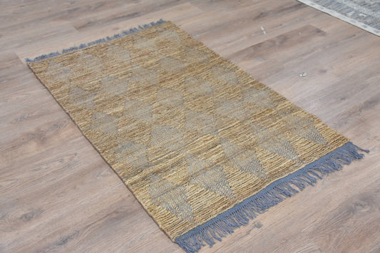Textured area rug with geometric pattern on a wooden floor