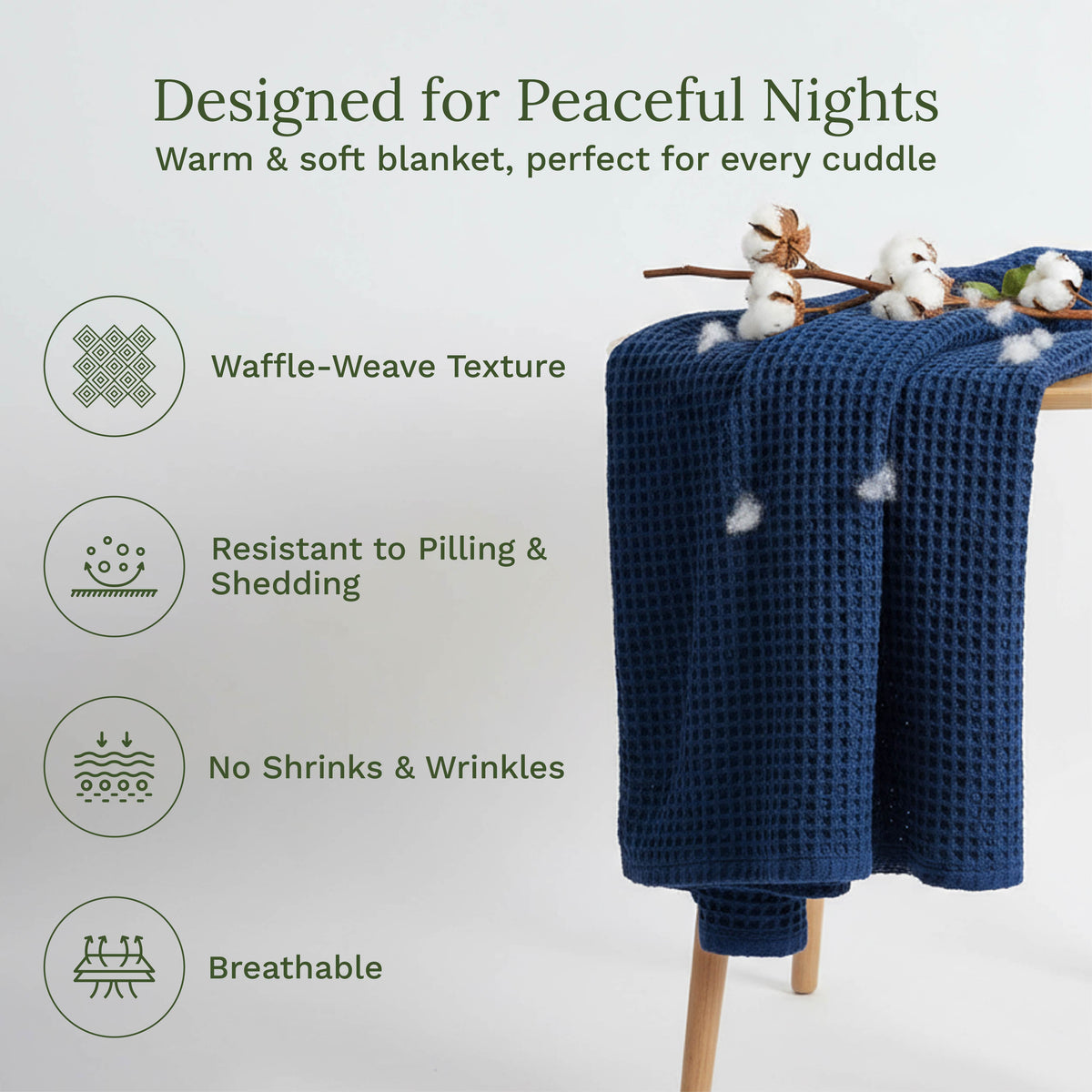 Blue waffle-weave blanket on a wooden stand with cotton branches, text highlighting features, and a light gray background.