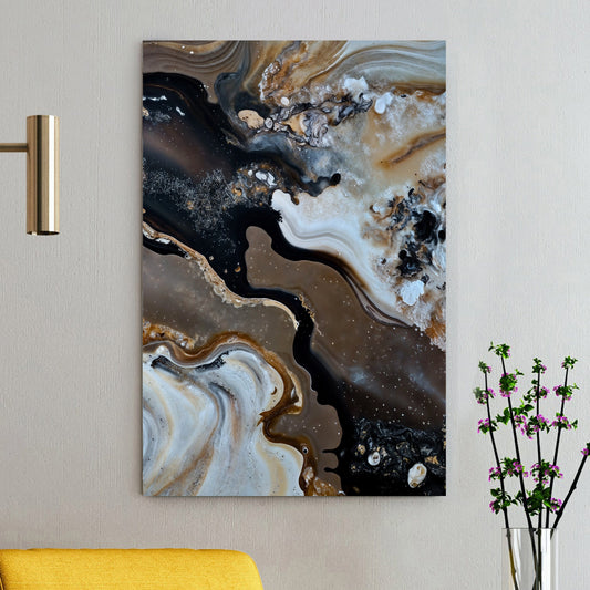 Abstract art piece on canvas up on a wall with a yellow chair and decorative plant in the foreground.