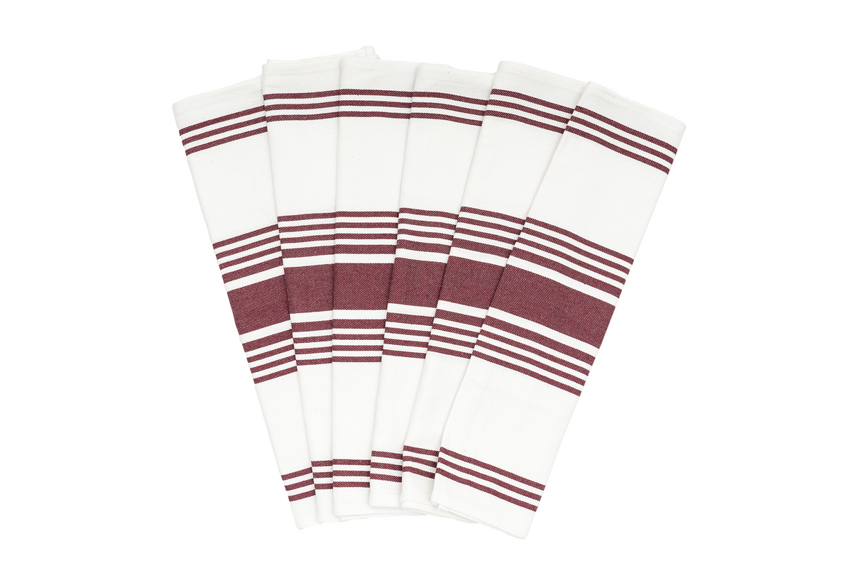 Set of white napkins with red stripes on a white background