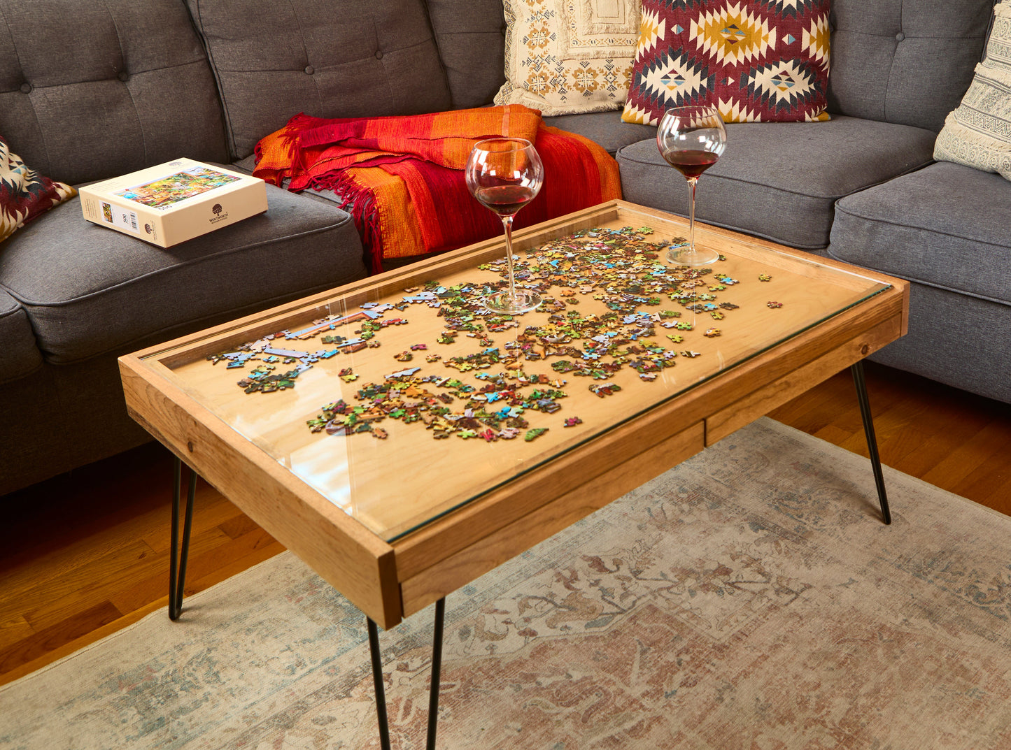 Coffee table with a puzzle on top in a living room setting