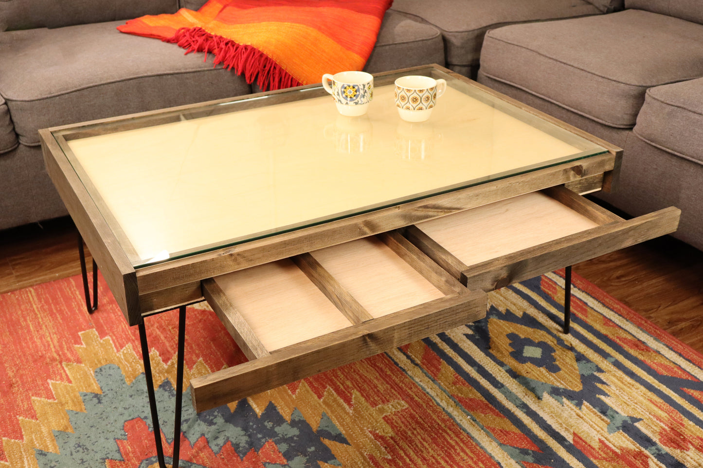 Coffee table with storage drawers in a living room setting