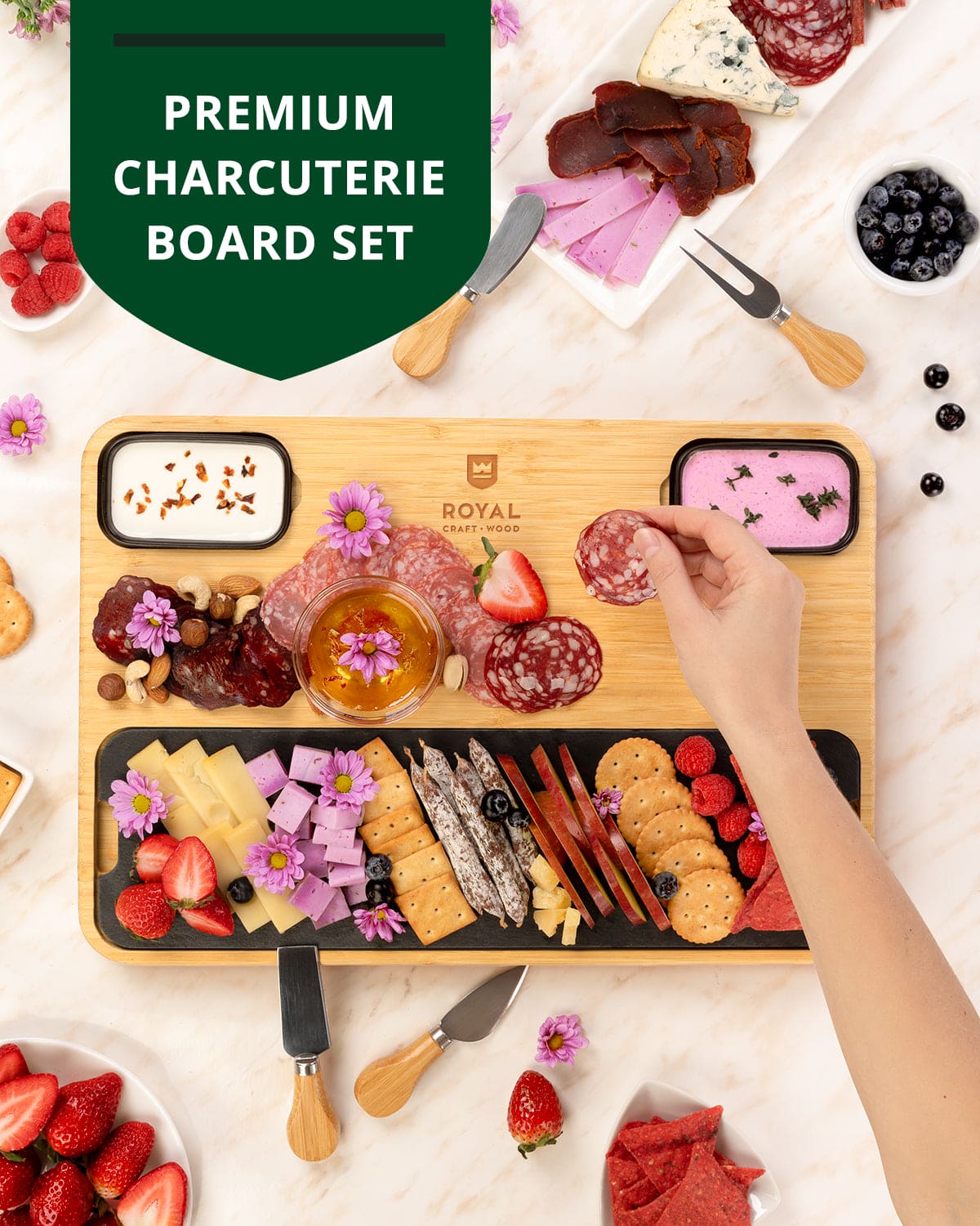 Premium charcuterie board set with various meats, cheeses, and fruits on a wooden board.