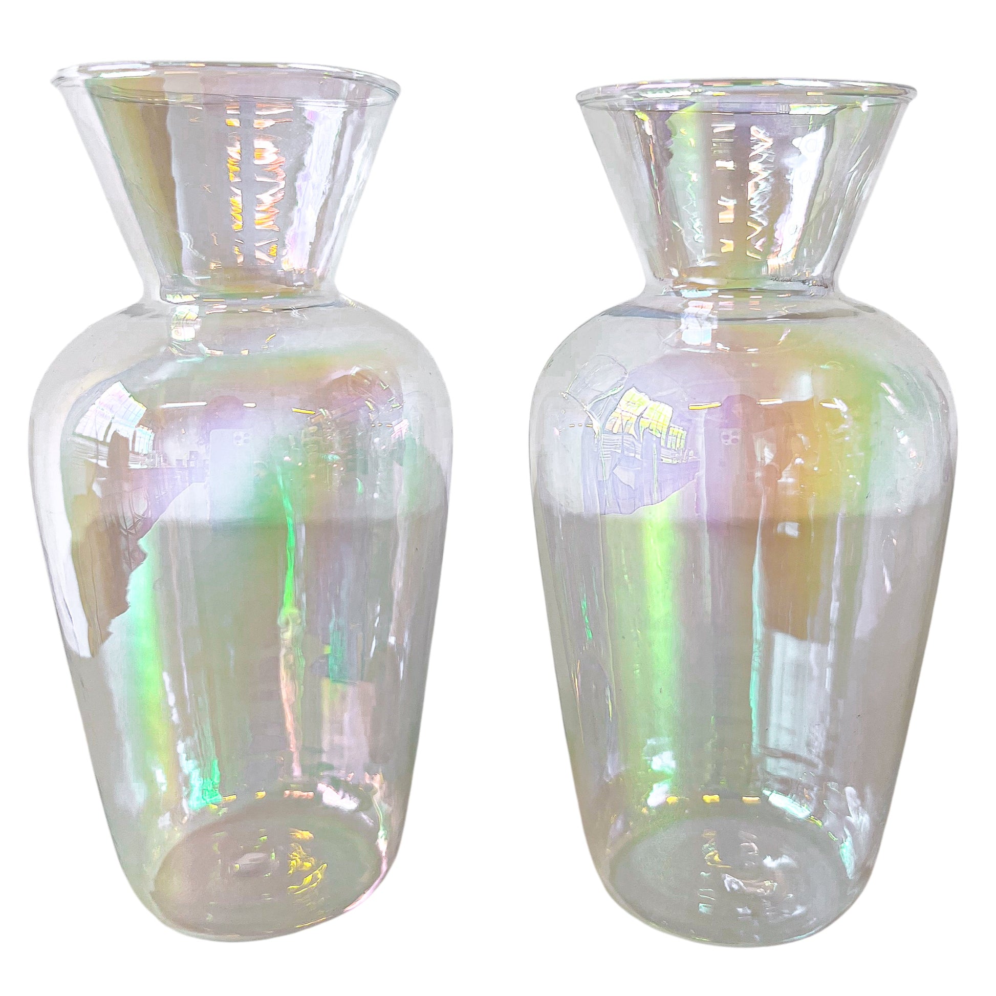 Two iridescent glass vases on a white background