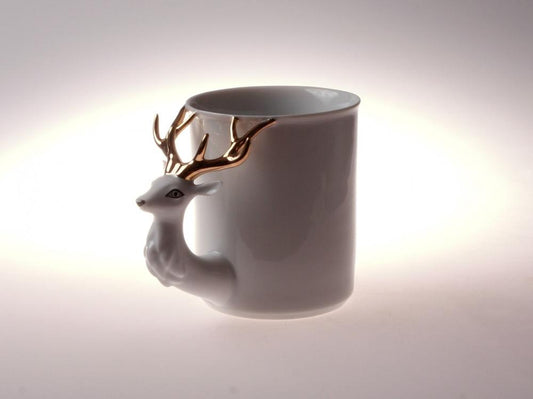 Hand-painted white porcelain cup with retro deer design and Art Deco stripes. 12oz capacity for coffee or tea. Decorative tableware with vintage charm.