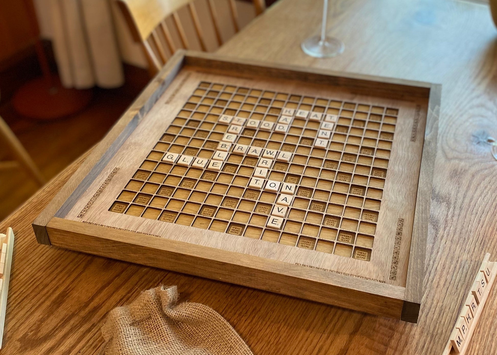 Wooden scrabble board game on a wooden table