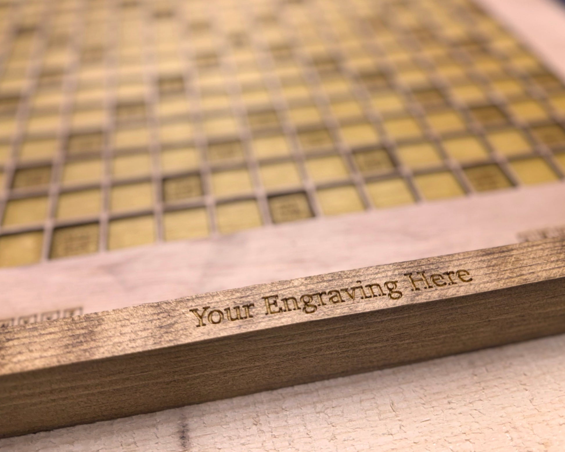 Wooden plaque with engraved text on a textured surface