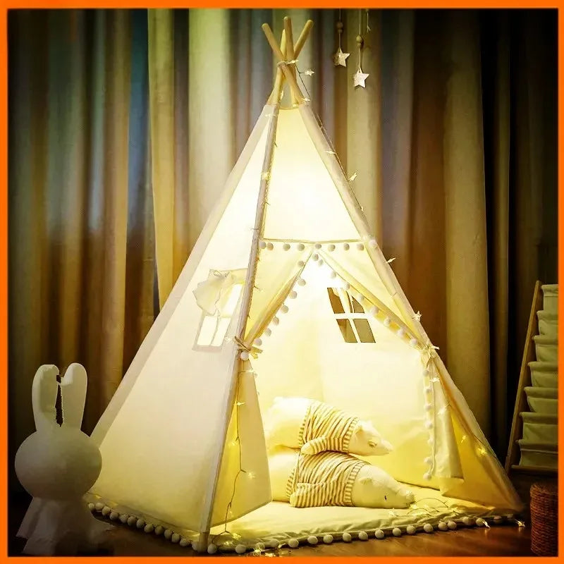 Children's teepee tent with lights and cushions in a room setting