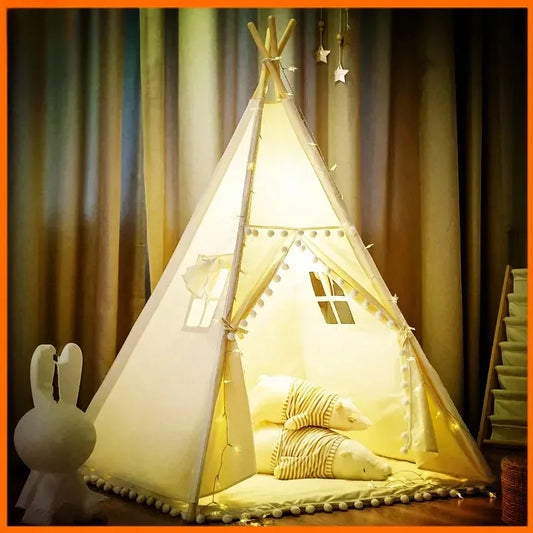 Children's teepee tent with lights and cushions in a room setting