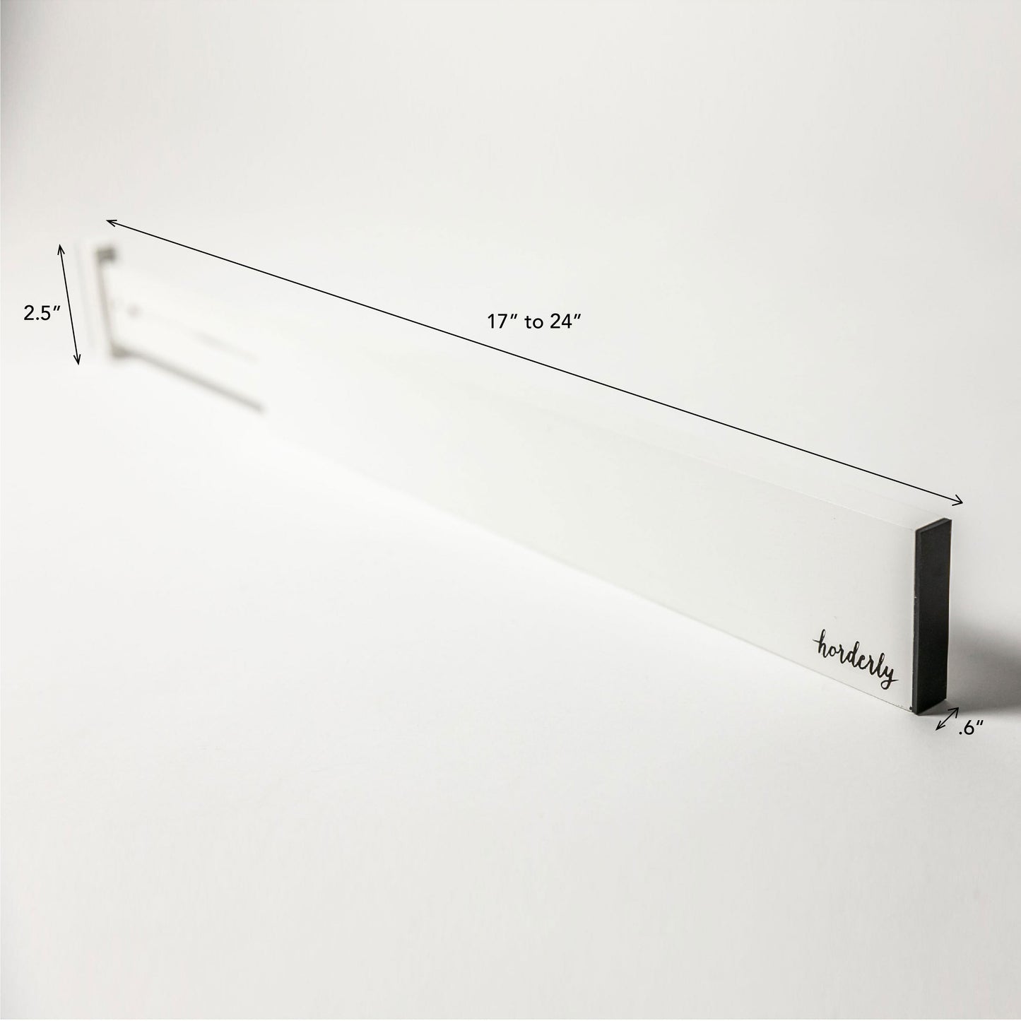 White rectangular expandable bamboo drawer separator with horderly branding on a white background -- measurements 17" to 24", .6", 2.5"