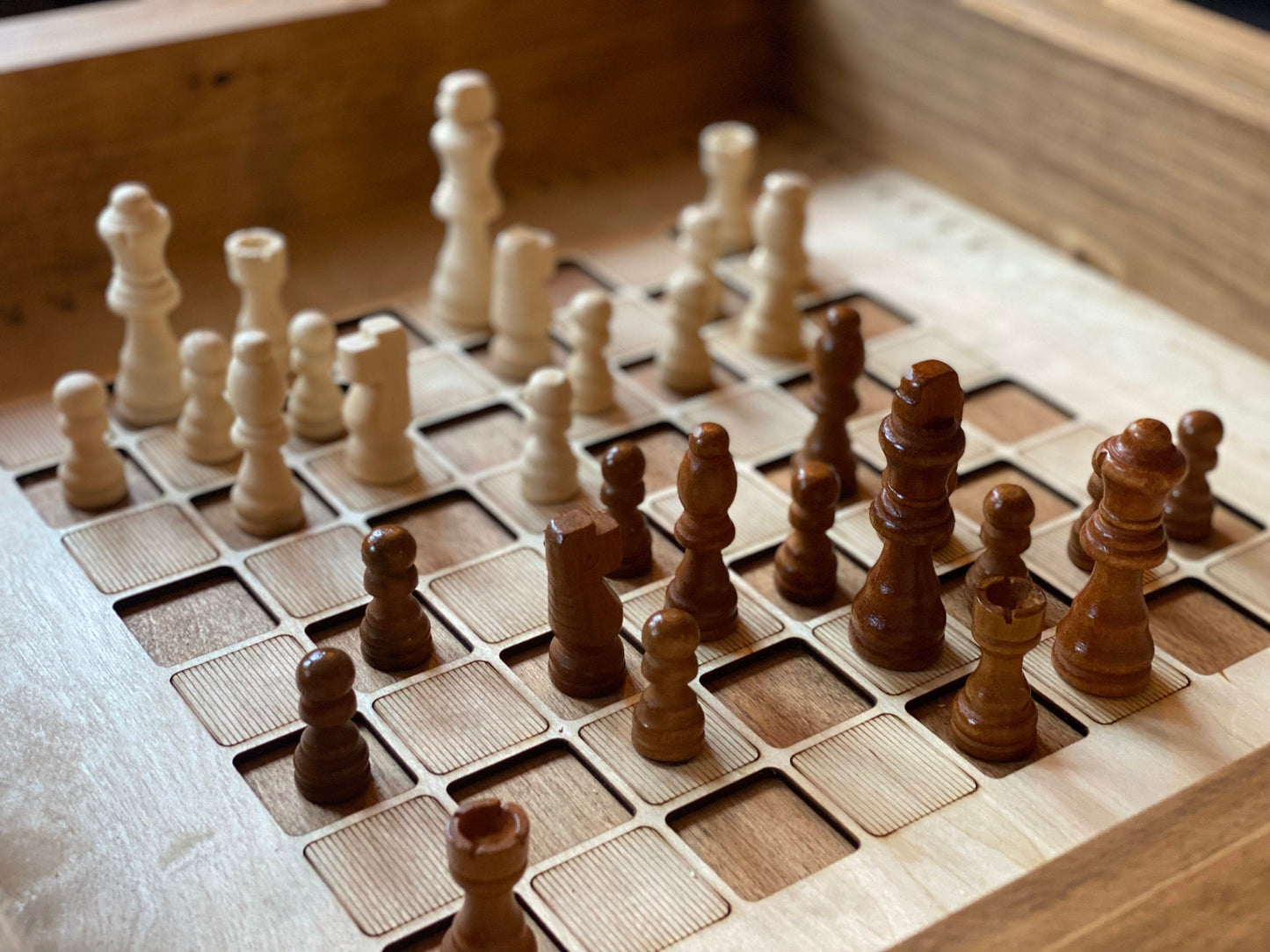 Wooden chess pieces on a chessboard with a wooden surface background