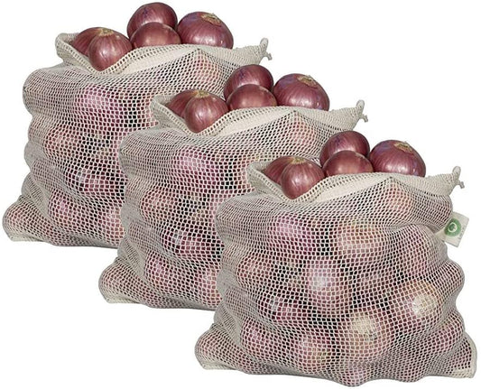 Three mesh bags filled with red onions on a white background