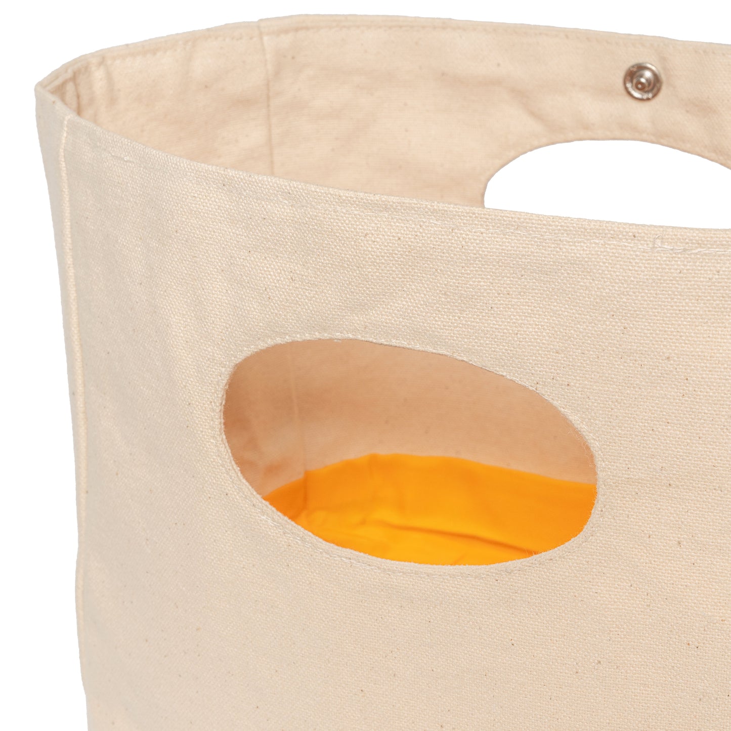 Beige fabric bag with a circular cutout revealing orange interior on a white background
